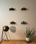 These shelves allow for the display of many items around the home or office.  We have pictures that show our shelves diplaying artwork, sunglasses, gaming controllers, books and more.  Our shelves add a decorative touch to any space..